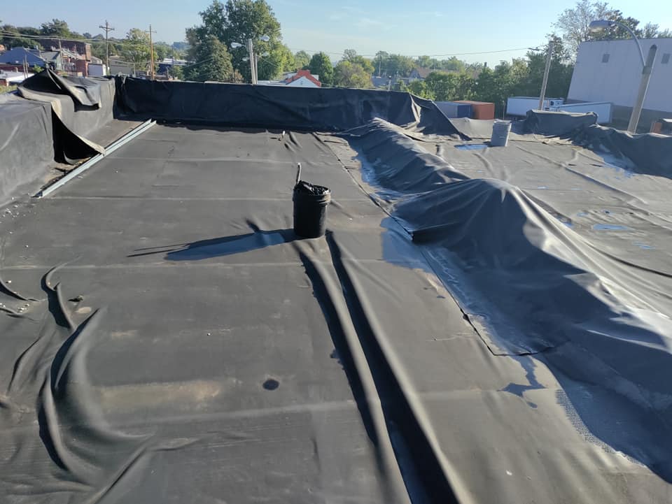 how to tarp a flat roof
